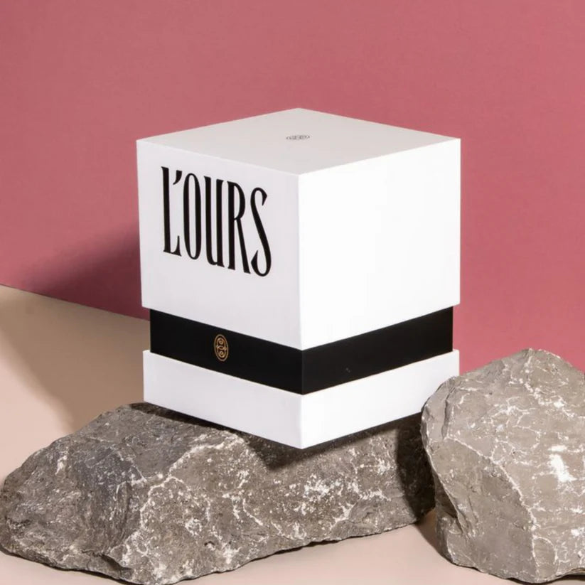 Custom rigid candle packaging box with gold foil logo.