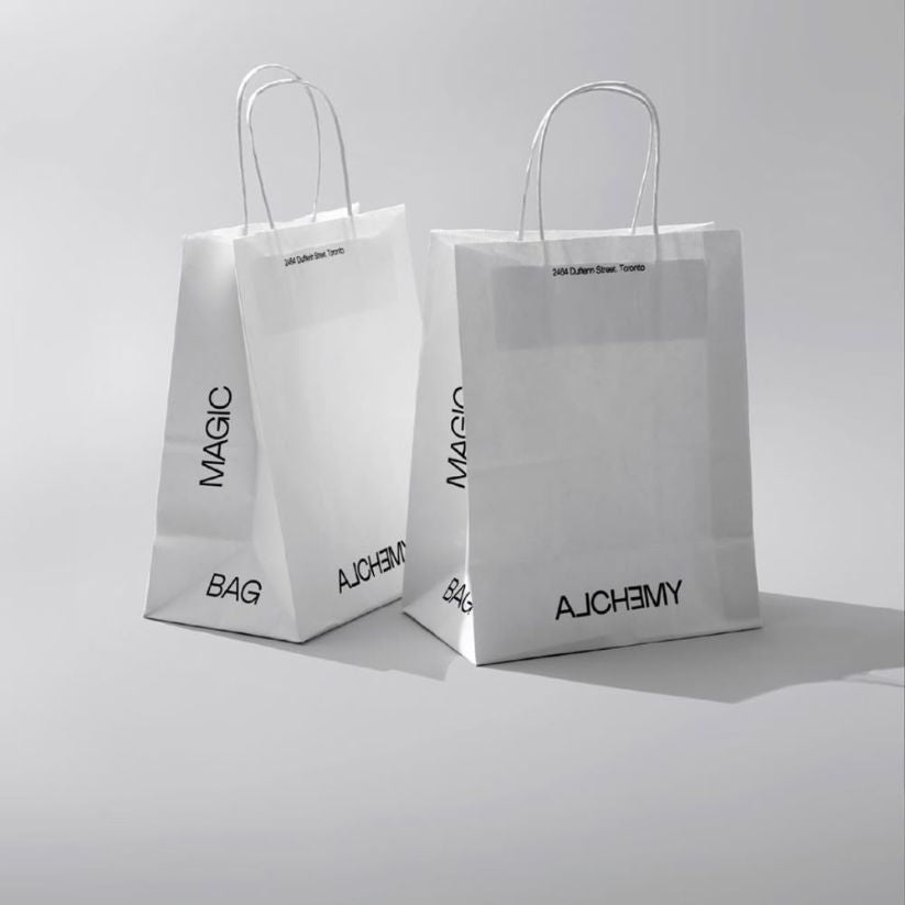 Sturdy kraft paper bag with twisted handles, ideal for retail stores and gift shops.