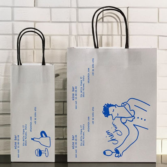 Custom twisted handle paper bag with logo printing for retail, gifts, and boutique packaging.