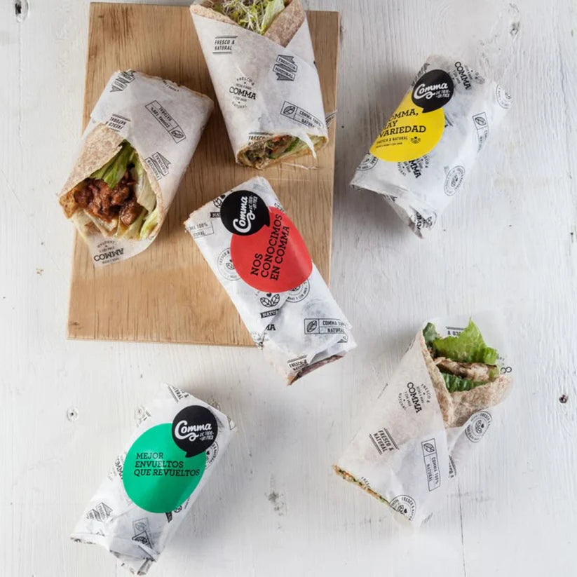 Grease-resistant wax paper used for wrapping burgers and sandwiches.