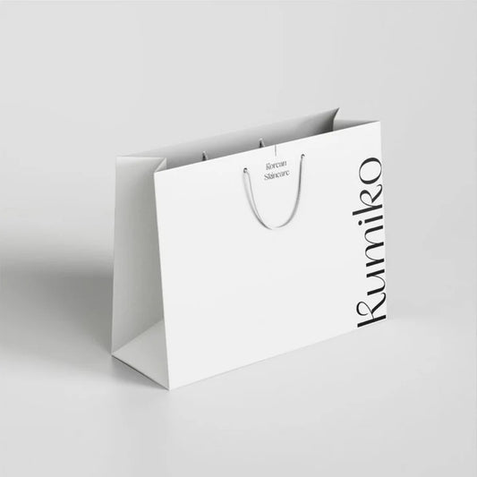 Luxury paper bag with custom logo printing for boutique and retail packaging.