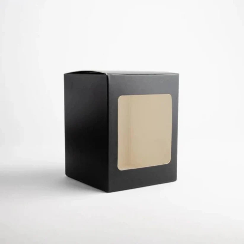 Printed candle packaging box with die cut window and custom branding for retail shelf display.